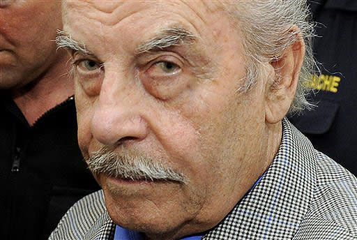 FILE -- Josef Fritzl is escorted to the fourth day of his trial in the provincial courthouse in St. Poelten, Austria, on March 19, 2009. / Credit: AP Photo/Robert Jaeger