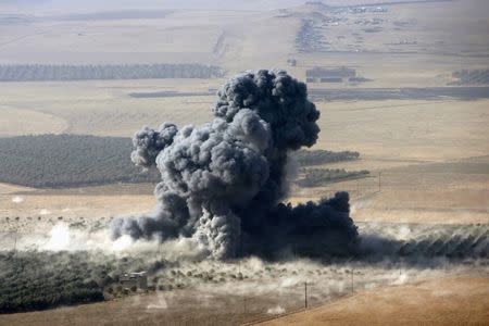 Smoke rises at Islamic State militants' positions in the town of Naweran, near Mosul, Iraq, October 23, 2016. REUTERS/Azad Lashkari