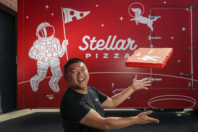 Hawthorne, CA - April 21: Benson Tsai, CEO and Co-founder, a former SpaceX engineer built a robot the size of a food truck that can be load with pizza dough balls and all the toppings and can then go out and make a pizza on demand every 90 seconds. Tsai was photographed in front of the truck at Stellar Pizza headquarters on Thursday, April 21, 2022 in Hawthorne, CA. (Irfan Khan / Los Angeles Times)