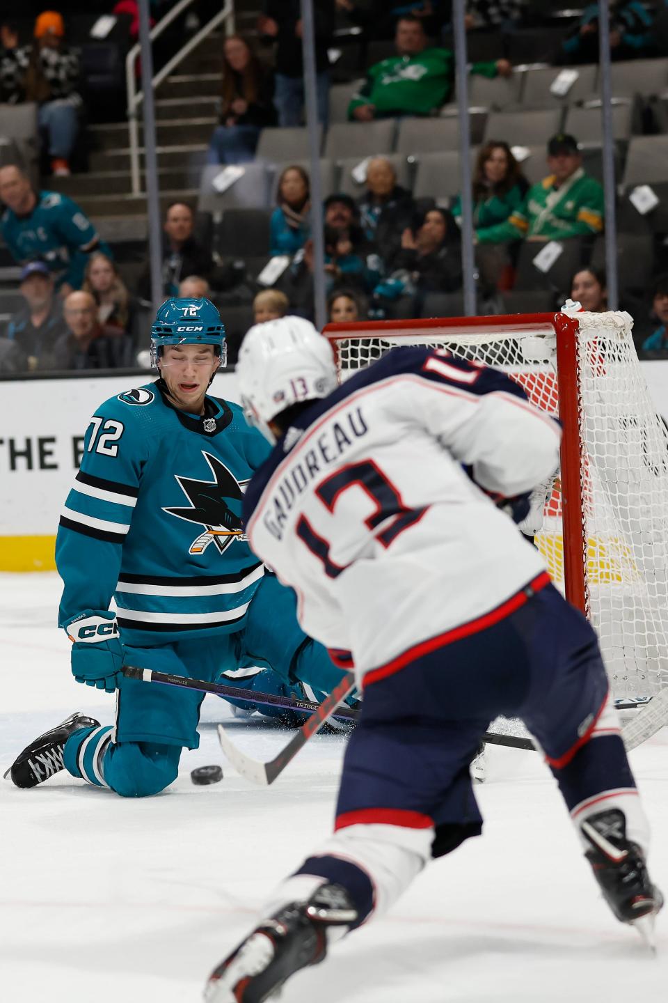 San Jose Sharks left wing William Eklund (72) defends against a shot by Columbus Blue Jackets left wing Johnny Gaudreau that went in for an overtime goal in an NHL hockey game in San Jose, Calif., Tuesday, March 14, 2023. (AP Photo/Josie Lepe)