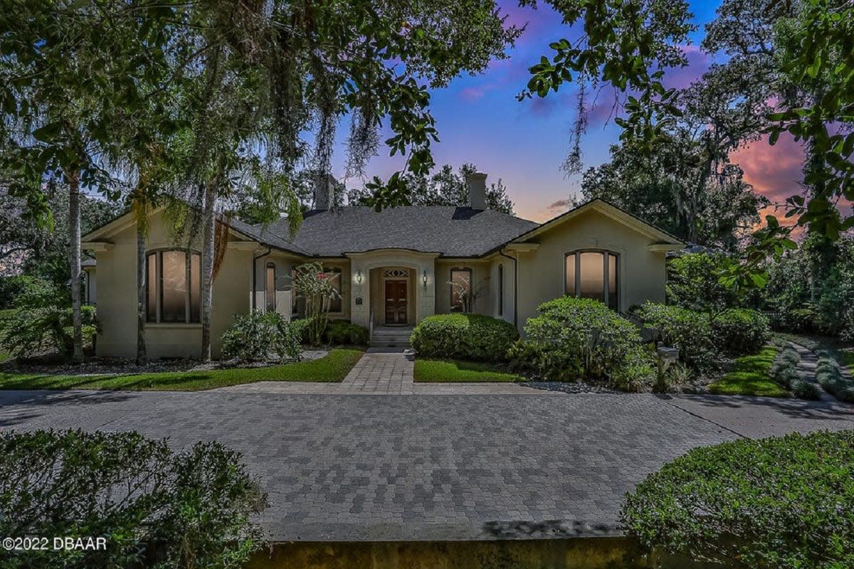 This private French provincial estate sits on nearly two riverfront acres just blocks from downtown Ormond Beach.