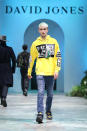 <p>Gigi and Bella Hadid’s little brother brought a funky edge to the runway when he came out wearing this bright yellow jumper and distressed denim jeans. Photo: Getty Images </p>