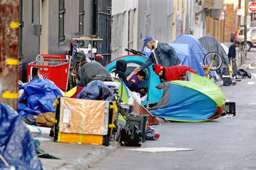 SAN FRANCISCO, CA - FEBRUARY 24: Homeless people consume illegal drugs in an encampment along Willow St. in the Tenderloin district of downtown on Thursday, Feb. 24, 2022 in San Francisco, CA. London Breed, mayor of San Francisco, is the 45th mayor of the City and County of San Francisco. She was supervisor for District 5 and was president of the Board of Supervisors from 2015 to 2018. (Gary Coronado / Los Angeles Times)