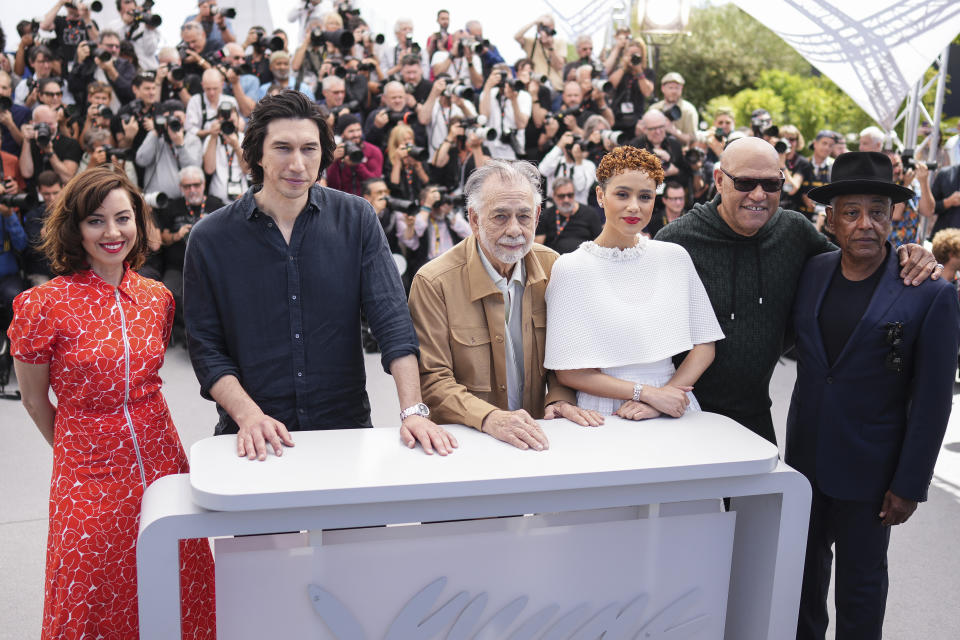 Aubrey Plaza, from left, Adam Driver, director Francis Ford Coppola, Nathalie Emmanuel, Laurence Fishburne, and Giancarlo Esposito pose for photographers at the photo call for the film 'Megalopolis' at the 77th international film festival, Cannes, southern France, Friday, May 17, 2024. (Photo by Scott A Garfitt/Invision/AP)