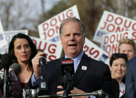 Democratic Alabama U.S. Senate candidate Doug Jones speaks with the media after casting his vote at Brookwood Baptist Church in Mountain Brook, Alabama, U.S. December 12, 2017. REUTERS/Marvin Gentry