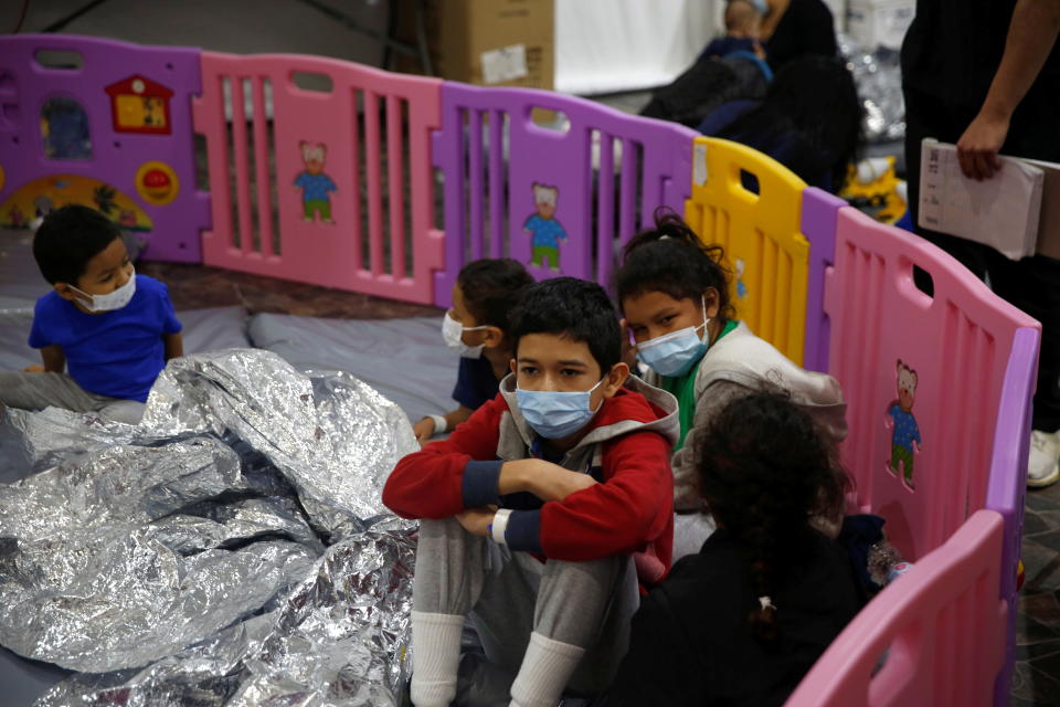 Young unaccompanied migrants, who range in age from 3 to 9, sit inside a playpen at the U.S. Customs and Border Protection facility in Donna, Texas on March 30, 2021. The main detention center for unaccompanied children in the Rio Grande Valley, the Donna facility is holding 4,100 migrants, most of whom are unaccompanied minors, four times its pre-COVID capacity. (Dario Lopez-Mills/Pool via Reuters) 