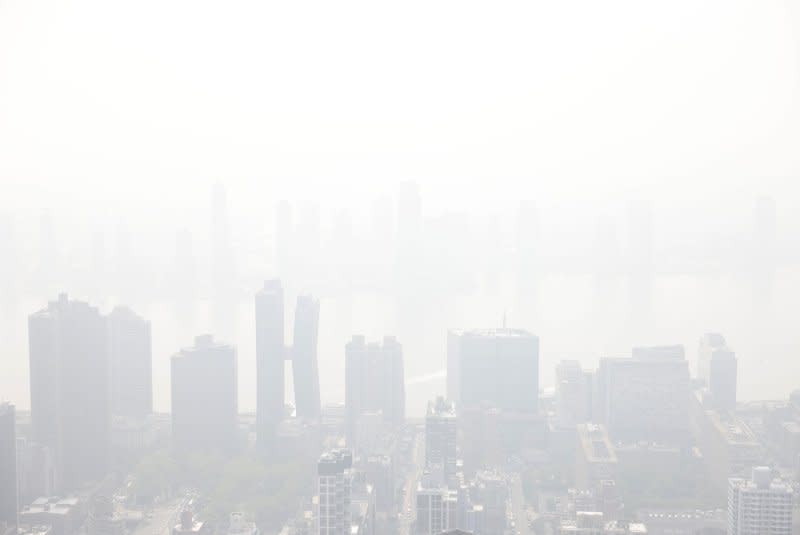 Tourists visit the observation deck of the Empire State Building as haze and smoke due to wildfires in Canada shroud the views of the Manhattan skyline on June 30 in New York City. File Photo by John Angelillo/UPI