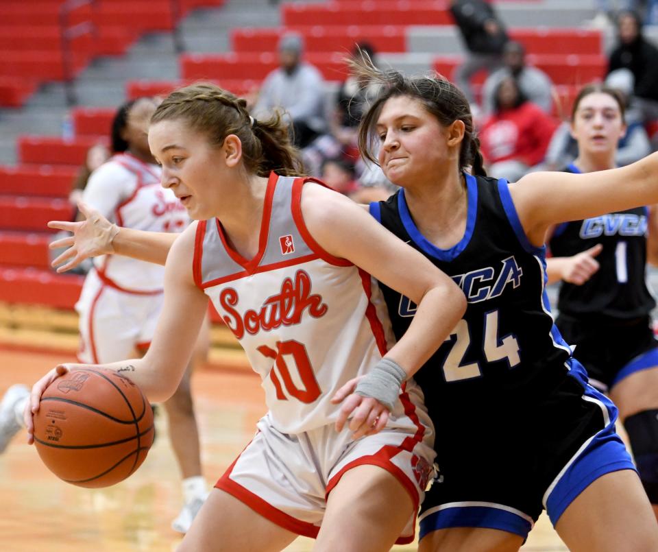 Canton South's Sydney Comer tries to break around CVCA's Hadley Hajdu in girls basketball at Canton South.  Saturday, February 04, 2023.