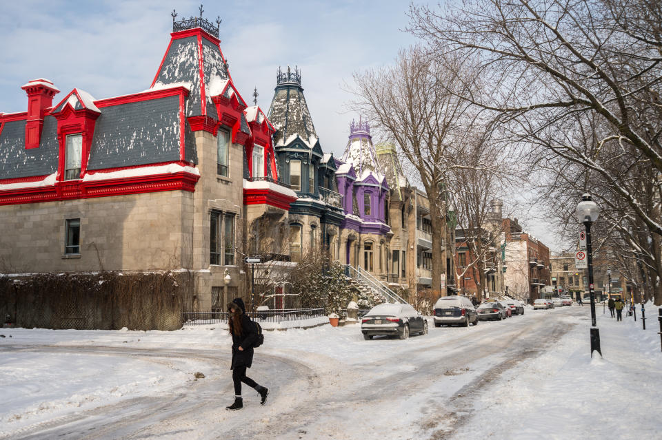 Montreal, Canada - December 17, 2016: Victorian Colorful houses in Square Saint Louis in winter