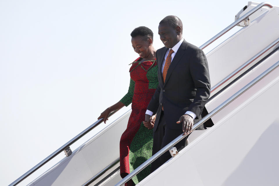 Kenya's President William Ruto, right, and first lady Rachel Ruto arrive at Andrews Air Force Base, Md., Wednesday, May 22, 2024, for a state visit to the United States. (AP Photo/Luis M. Alvarez)