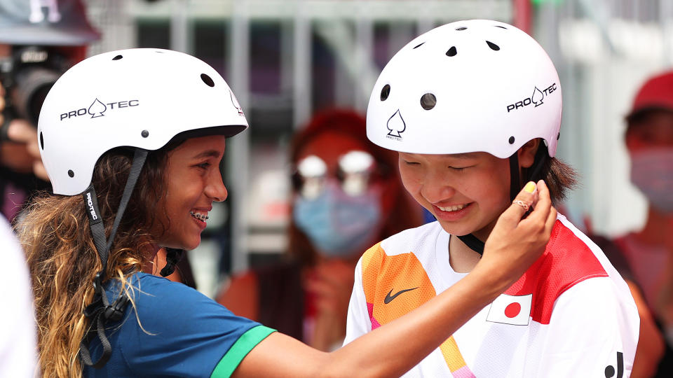 Rayssa Leal of Team Brazil puts her hand up to the face of Momiji Nishiya of Team Japan during the Women's Street Final. (Photo by Patrick Smith/Getty Images)