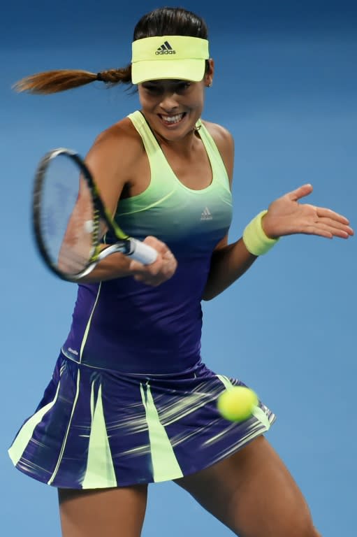 Ana Ivanovic of Serbia returns to Casey Dellacqua of Australia during their first round women's singles match at the China Open tennis tournament in Beijing on October 3, 2015