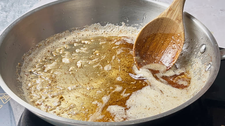 stirring brown butter in skillet