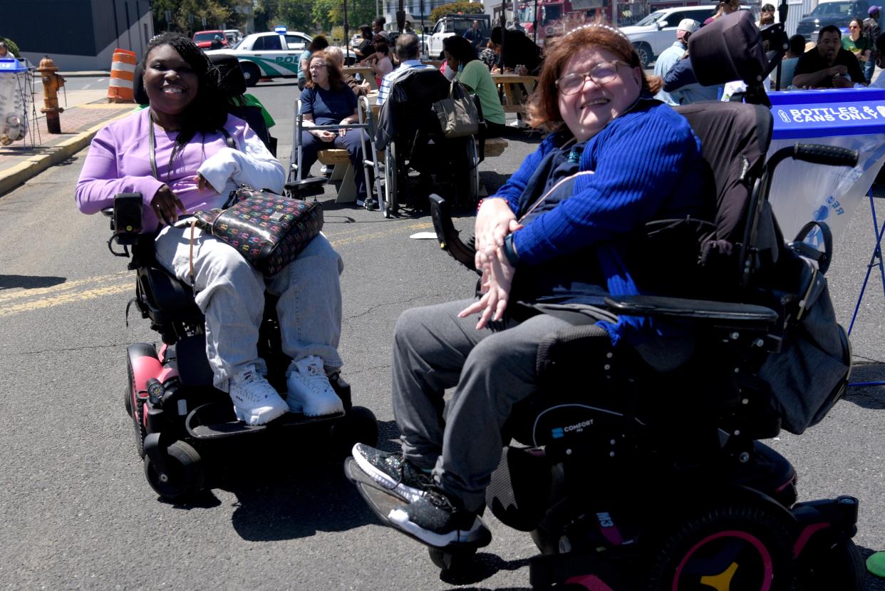 Marlene Brockington, left, and her friend Amanda Chirelli pose for a photo at a disability resource fair hosted by MOCEANS Center for Independent Living on Saturday, May 6, 2023, in Long Branch, New Jersey. Chirelli is an outreach coordinator at MOCEANS.