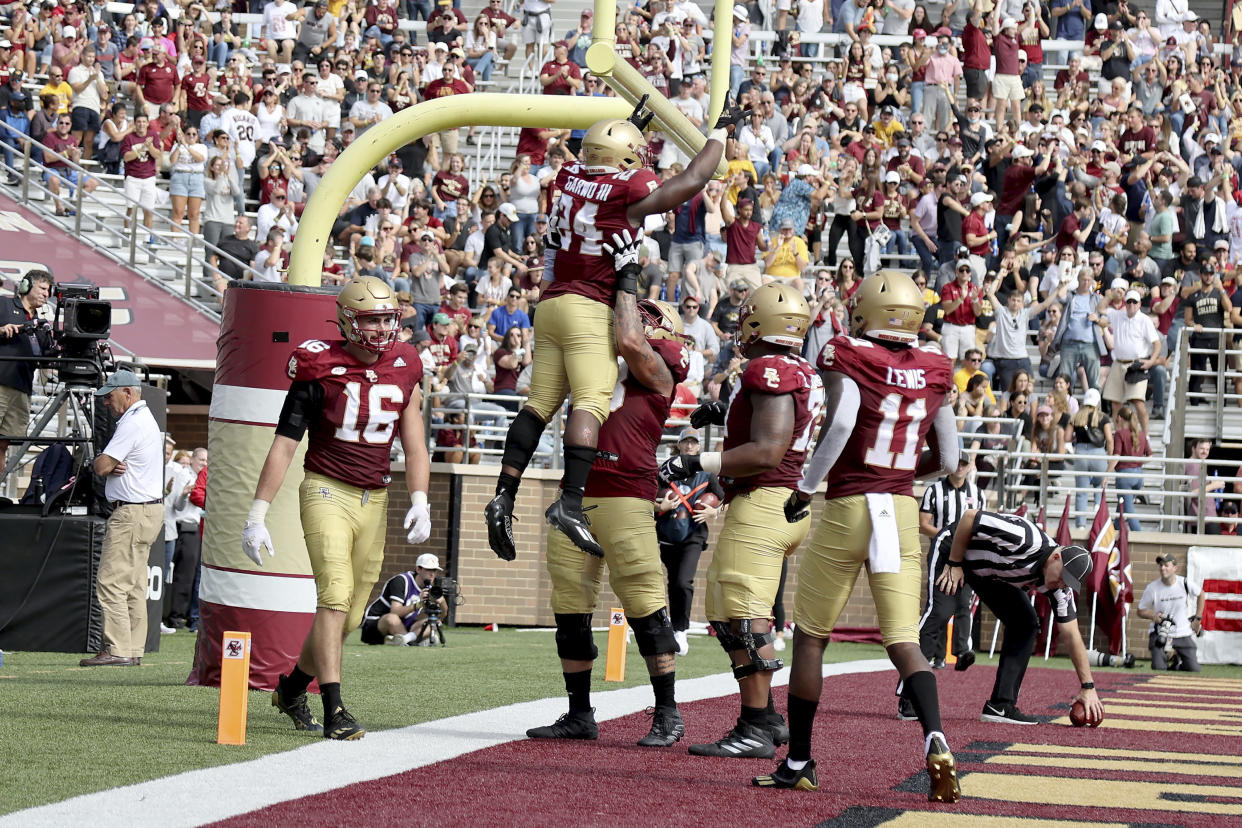 Boston College running back Pat Garwo III (24) is lifted by a teammate after scoring a touchdown during the second half of an NCAA college football game against Missouri, Saturday, Sept. 25, 2021, in Boston. (AP Photo/Mary Schwalm)