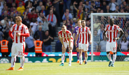 Soccer Football - Premier League - Stoke City vs Crystal Palace - bet365 Stadium, Stoke-on-Trent, Britain - May 5, 2018 Stoke City's Ryan Shawcross and team mates react after conceding their second goal scored by Crystal Palace's Patrick van Aanholt Action Images via Reuters/Carl Recine