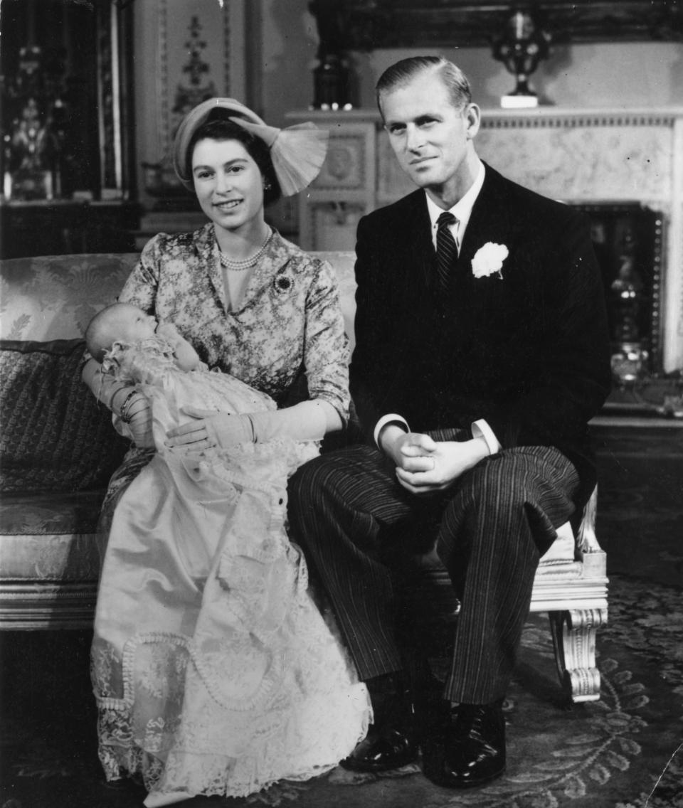 Princess Elizabeth holds Princess Anne (born Aug. 15, 1950) alongside the Duke of Edinburgh on her christening day at Buckingham Palace in October 1950.
