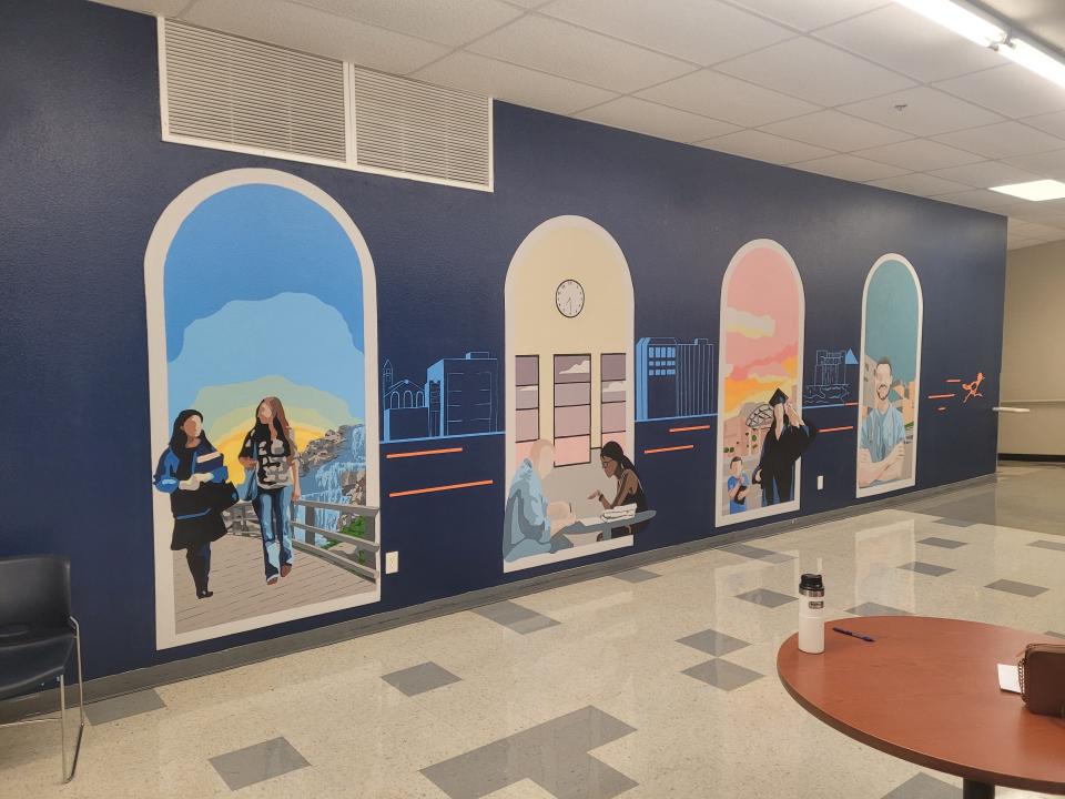 The "New Beginnings" mural depicts the student journey, from enrollment to entering the workforce.