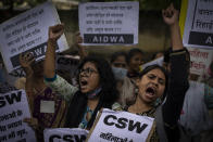 Women activists shout slogans against the remission of sentence by the government to convicts of a gang rape, in New Delhi, India, Thursday, Aug. 18, 2022. A Muslim woman who was gang raped while pregnant during India's devastating 2002 religious riots has appealed to the government to rescind its decision to free the 11 men who had been jailed for life for committing the crime, after they were released on suspended sentences. The 11 men, released on Monday when India celebrated 75 years of independence, were convicted in 2008 of rape, murder and unlawful assembly. (AP Photo/Altaf Qadri)