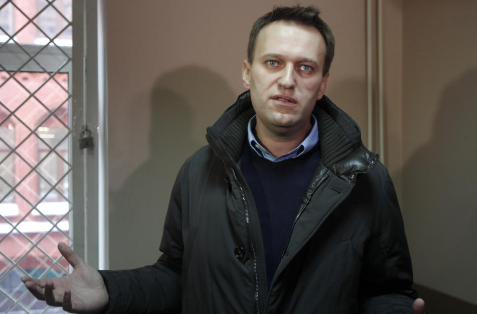 In this Thursday, March 15, 2012 file photo, opposition activist Alexei Navalny speaks to the media at a court in Moscow, Russia. Russia's leading corruption whistleblower on Friday, March 30, 2012, leveled accusations of graft at Prime Minister Vladimir Putin's close ally Igor Shuvalov. Alexei Navalny posted in his blog the scans of documents that show tens of millions of U.S. dollars transferred to the account of Shuvalov's company from firms that Navalny alleges are owned by billionaires Roman Abramovich and Alisher Usmanov.(AP Photo/Misha Japaridze, file)