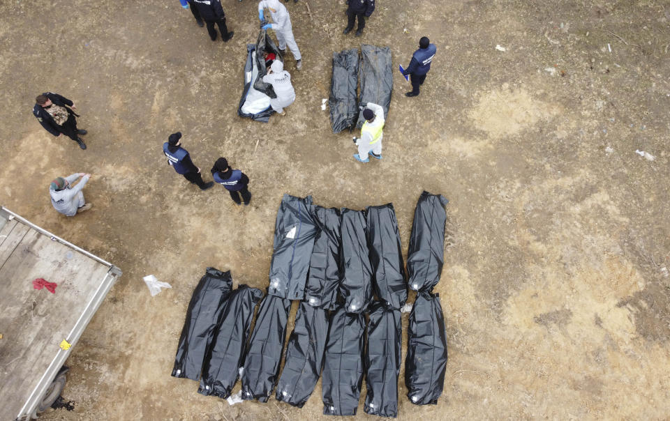 An aerial view of officials continue to exhume the bodies of civilians who died during the Russian attacks in Bucha. Source: Getty