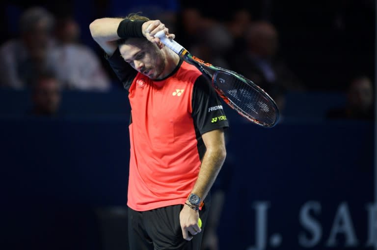 Top seed and US Open champion Stan Wawrinka slumped to a shock defeat to Mischa Zverev in Basel, limping out of the Swiss Indoors event in the quarter-finals