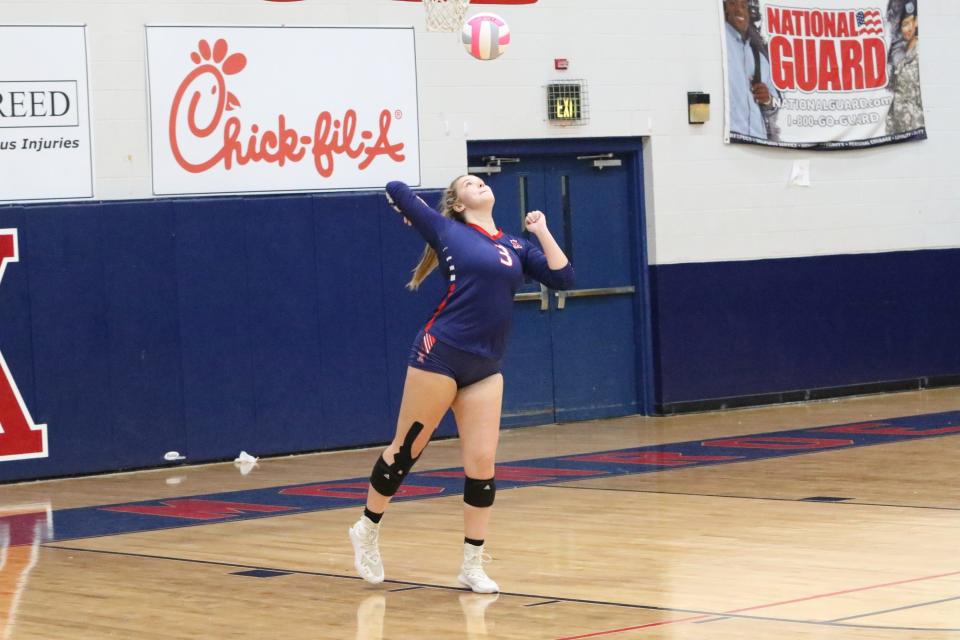 West Monroe's Kassidi Craig (3) seres the volleyball in a match with the Neville Tigers