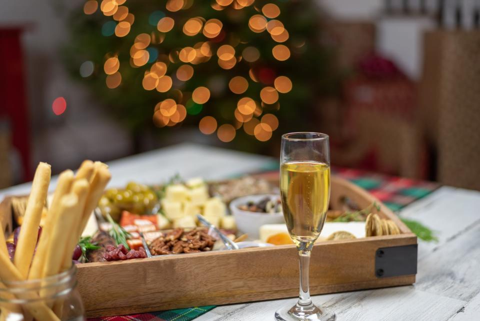 Holiday entertaining at home with charcuterie board and champagne