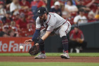 Atlanta Braves shortstop Dansby Swanson fields a ground ball by St. Louis Cardinals' Nolan Arenado, who was out at first during the fifth inning of a baseball game Wednesday, Aug. 4, 2021, in St. Louis. (AP Photo/Joe Puetz)