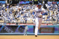 Los Angeles Dodgers' Freddie Freeman rounds the bases after hitting a solo home run during the third inning of a baseball game against the Cleveland Guardians in Los Angeles, Sunday, June 19, 2022. (AP Photo/Kyusung Gong)