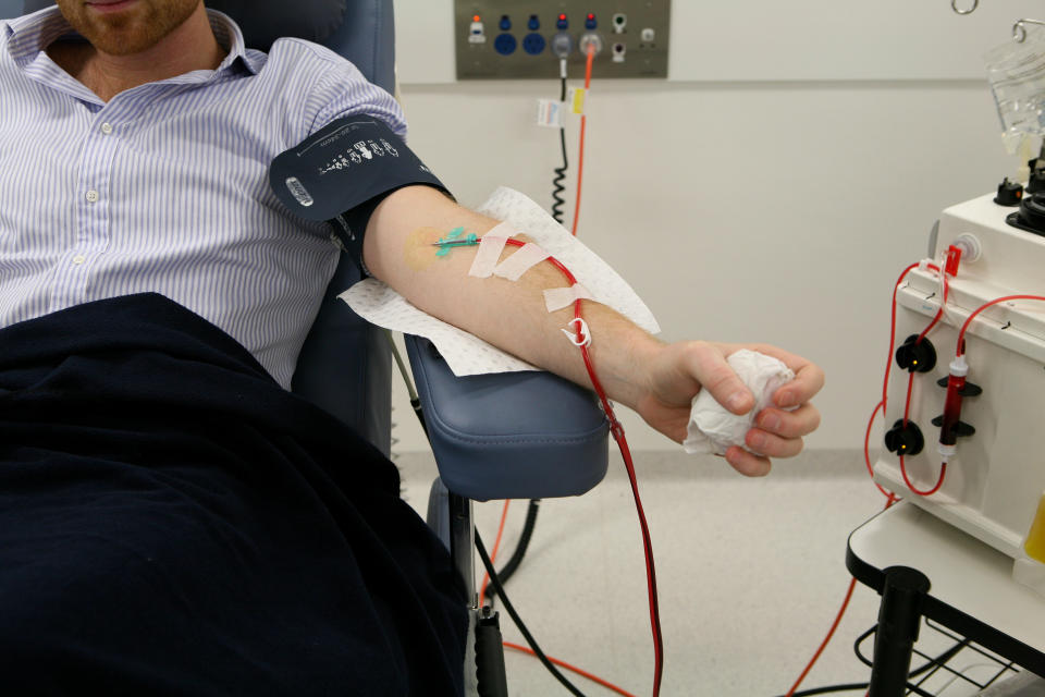 A man donates his plasma at the new Australian Red Cross Blood Service building at Town Hall in Sydney, Wednesday, June 1, 2011. (AAP Image/Angela Brkic)