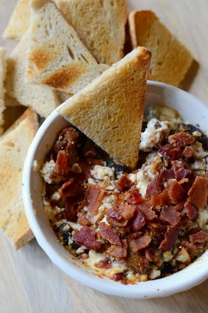 <p>As if a creamy goat cheese dip itself isn't tempting enough, this recipe also calls for crispy bacon bits and candied pecans.</p><p><em><a href="https://www.goodinthesimple.com/baked-goat-cheese-dip/" rel="nofollow noopener" target="_blank" data-ylk="slk:Get the recipe from Good in the Simple »;elm:context_link;itc:0;sec:content-canvas" class="link ">Get the recipe from Good in the Simple »</a></em></p>