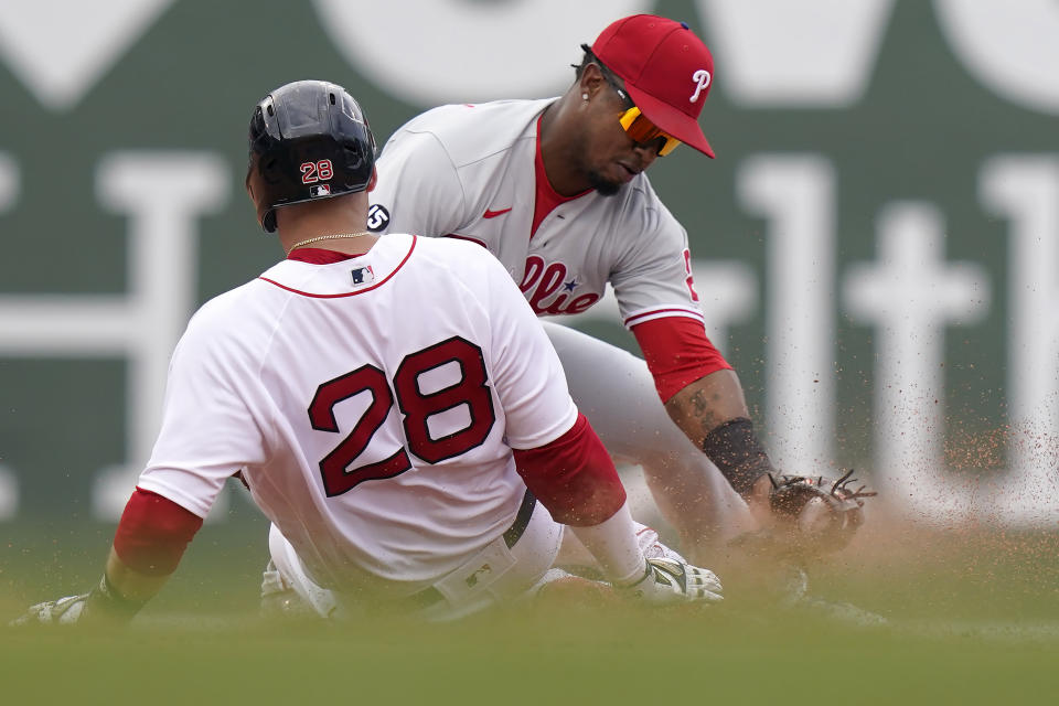 Boston Red Sox's J.D. Martinez (28) slides safely at second base on a double hit by Martinez as Philadelphia Phillies' Jean Segura (2) tries to tag him in the fifth inning of a baseball game, Sunday, July 11, 2021, in Boston. (AP Photo/Steven Senne)