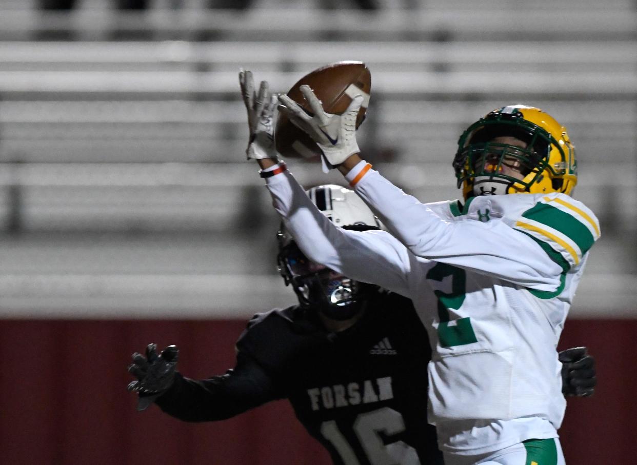 New Deal's Ethan Brown, right, catches the ball against Forsan in the Class 2A Division I area playoff game, Thursday, Nov. 17, 2022, at Mustang Stadium in Denver City. 