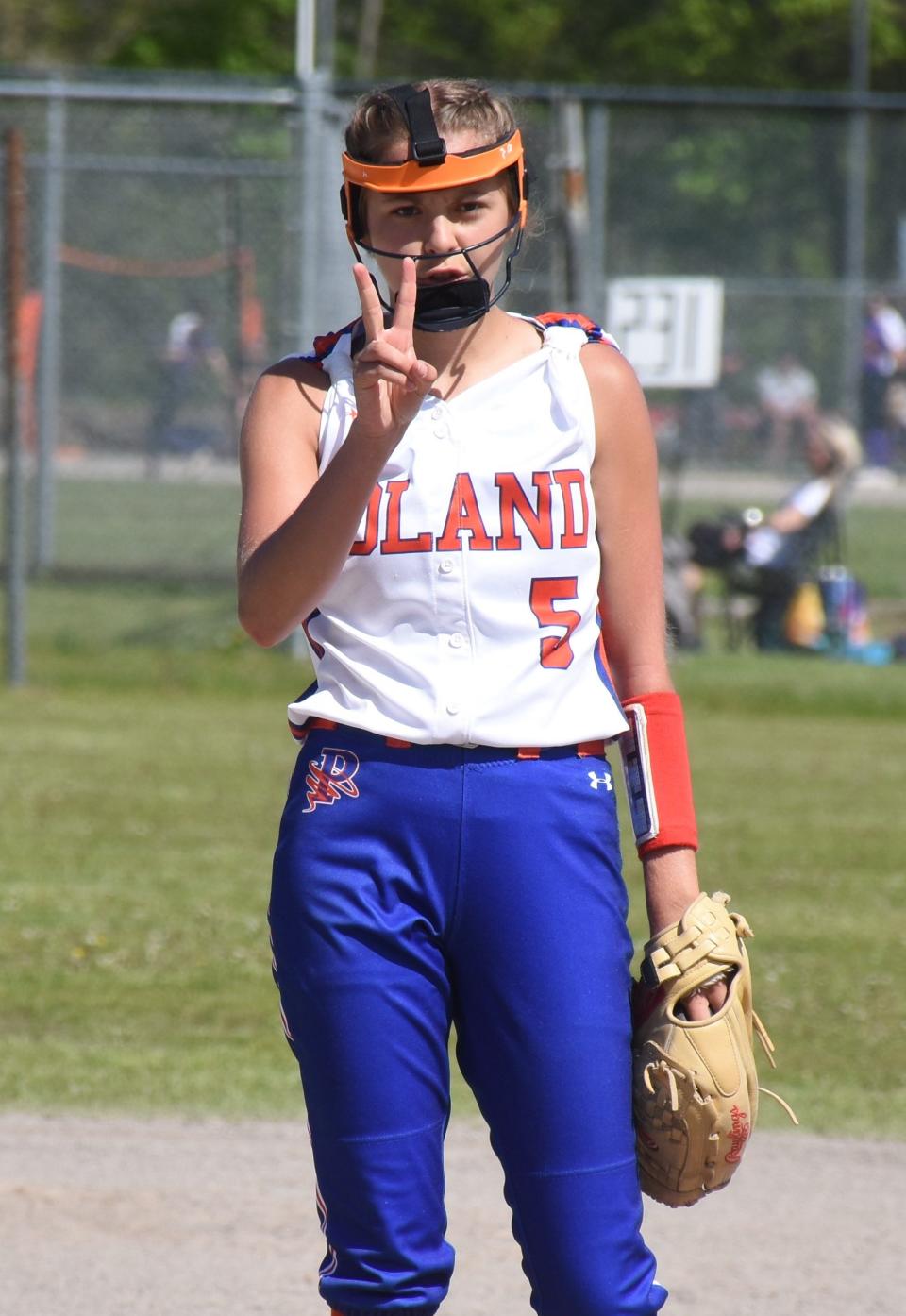 Poland pitcher Shelby Hagues, a senior who calls her own pitches, signals to her catcher May 13 during the Kristen Haver Tournament at the Mudville complex in Herkimer.