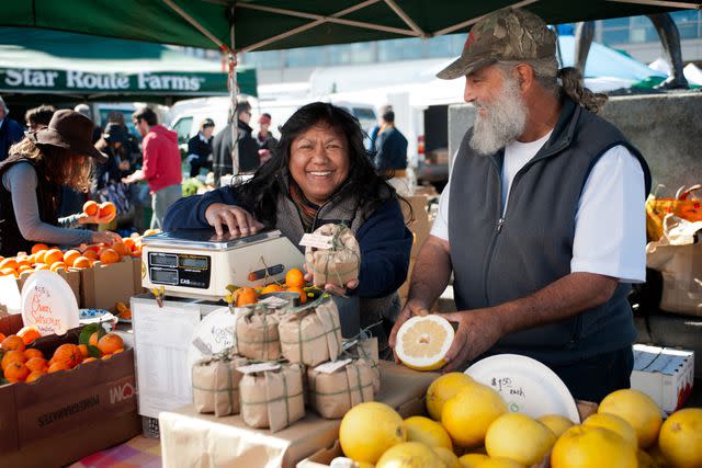 <p>Gary Yost Photography / Foodwise</p> Vendors at the Tory Farms stand at the Ferry Plaza Farmers Market