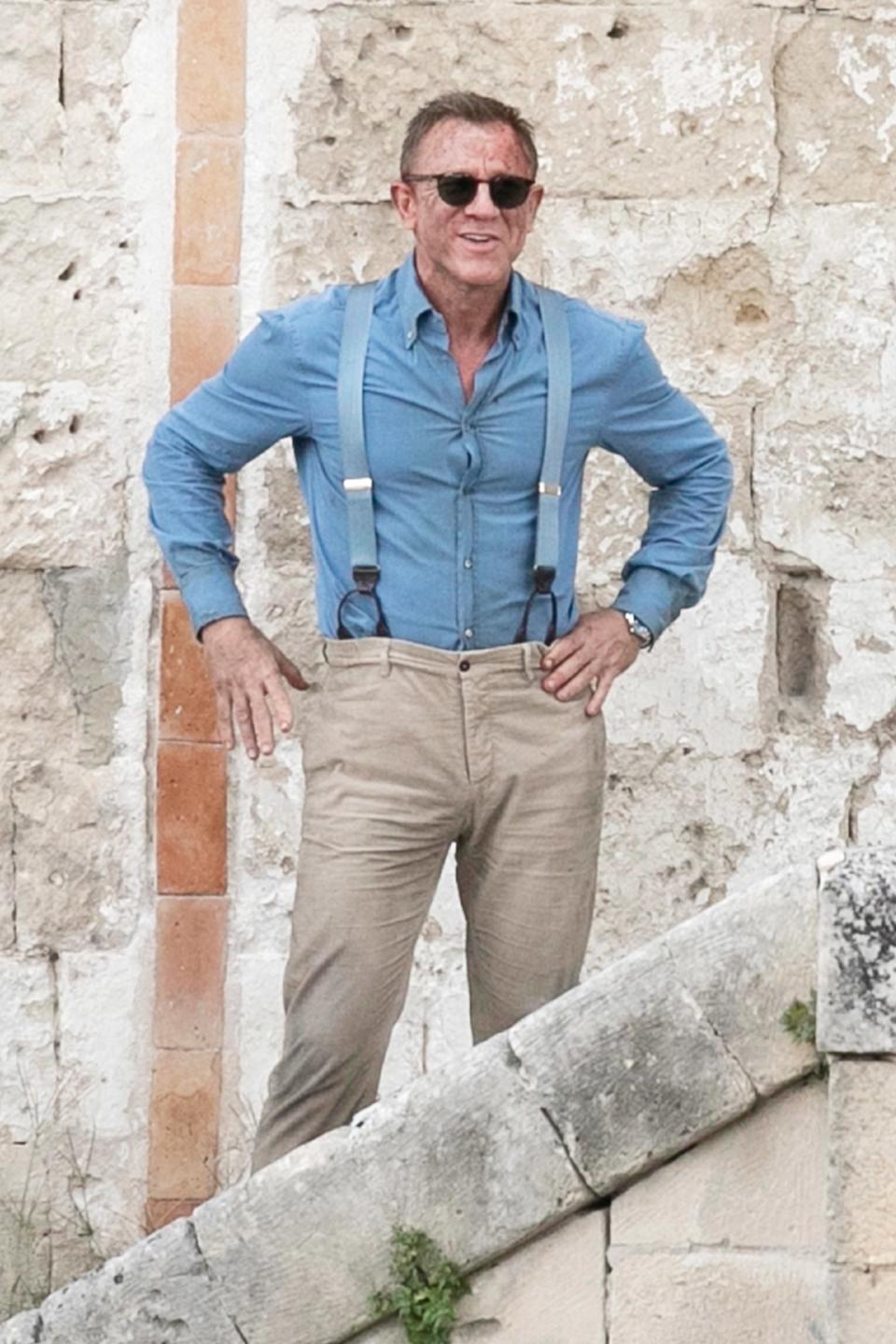 Daniel Craig gets rough around the edges on Tuesday while filming the new Bond movie,<em> No Time to Die,</em> in Matera, Italy.