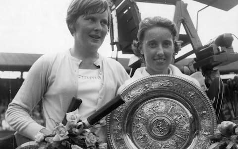 Fellow Briton Angela Mortimer with the trophy after beating Christine Truman (left) in the Wimbledon final in 1961 - Credit: getty images