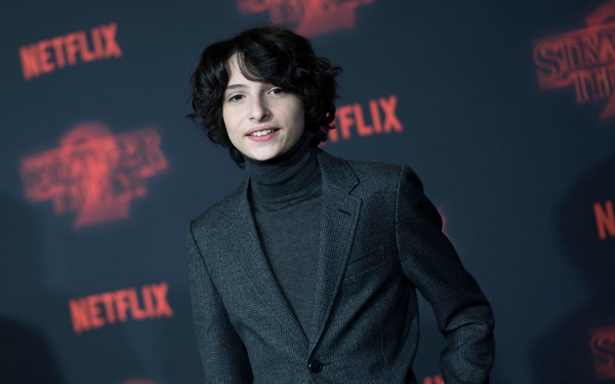 Finn Wolfhard has criticised a model who appeared to flirt with him on social media - AFP