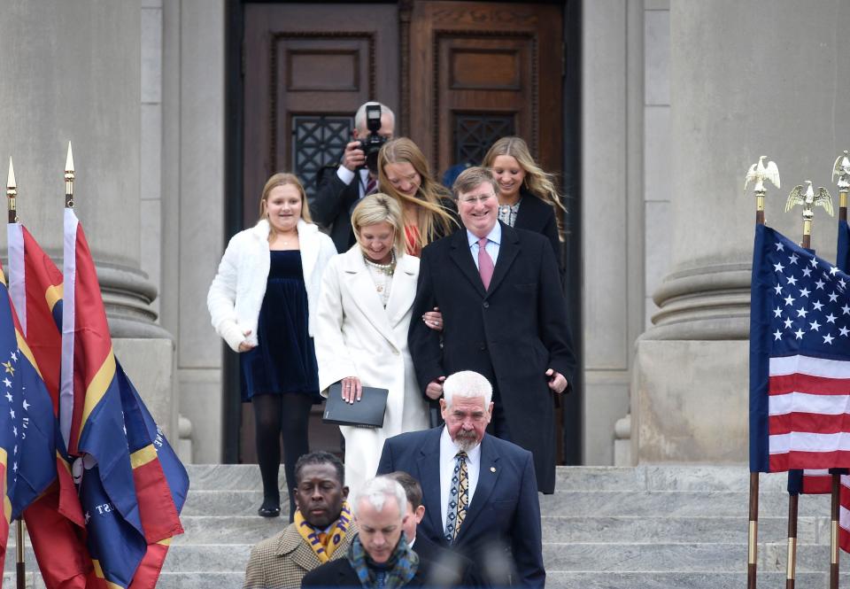 Gov. Tate Reeves, center right, his wife Elee Reeves center left, and their daughters, background from right, Tyler, Emma and Maddie exit the state Capitol for inauguration ceremonies in Jackson, Miss., Tuesday, Jan. 9, 2023.