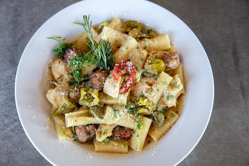 The Chicken Social at F St. Social, prepared with hot and sweet cherry peppers, garlic white wine sauce, crumbled sausage and served over pasta (or rice pilaf).