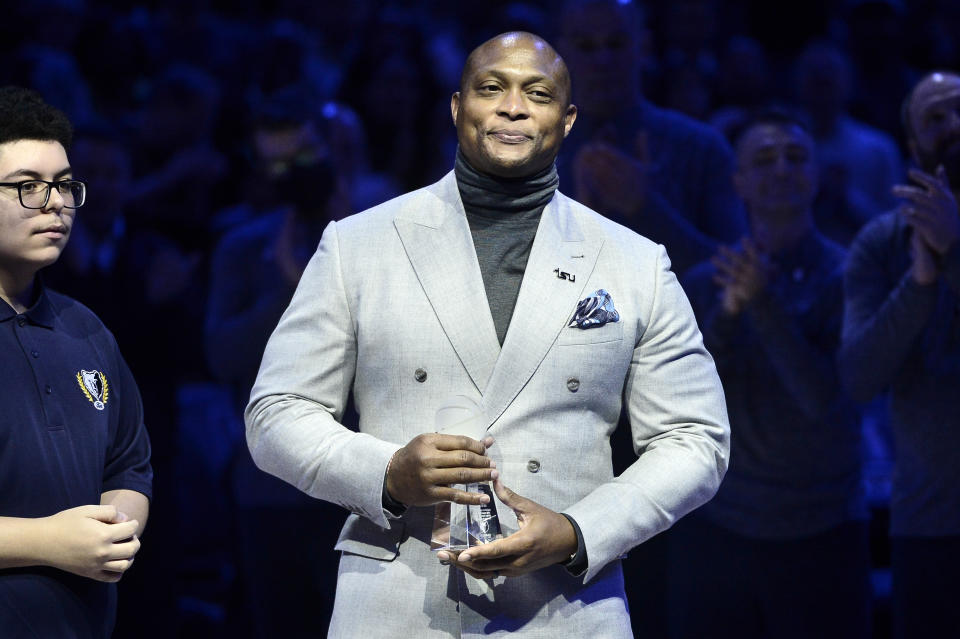 Eddie George, right, accepts the 18th annual National Civil Rights Museum Sports Legacy Award along with fellow honorees Gary Payton, Luol Deng, and Nancy Leiberman before the 21st annual Martin Luther King Jr. Day Celebration Game between the Phoenix Suns and the Memphis Grizzlies, Monday, Jan. 16, 2023, in Memphis, Tenn. (AP Photo/Brandon Dill)