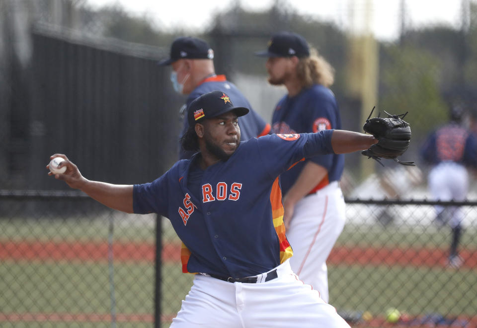 Houston Astros pitcher Pedro Baez throws a bullpen session during spring training baseball in West Palm Beach, Fla., Monday, Feb. 22, 2021. (Karen Warren/Houston Chronicle via AP)