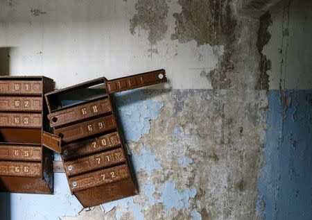 Mailboxes are seen in an apartment which was evacuated after an explosion at the Chernobyl nuclear power plant, in the ghost town of Pripyat, Ukraine April 18, 2016. REUTERS/Gleb Garanich