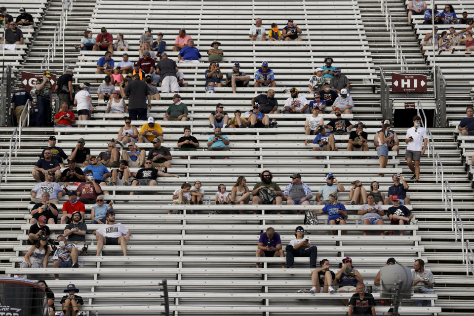 Fans wait for the start of a NASCAR All-Star Open auto race at Bristol Motor Speedway in Bristol, Tenn, Wednesday, July 15, 2020. (AP Photo/Mark Humphrey)