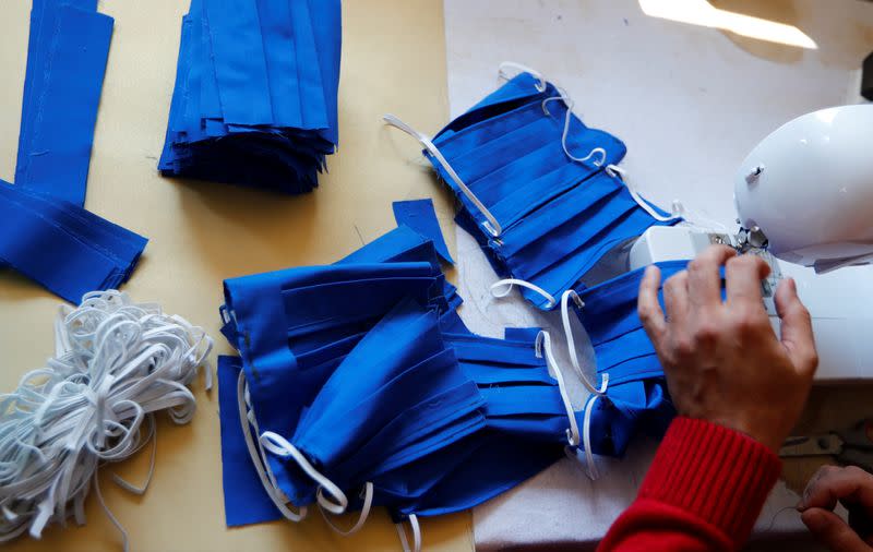 Iranian refugee sews face masks as the spread of the coronavirus disease (COVID-19) continues in Jueterbog