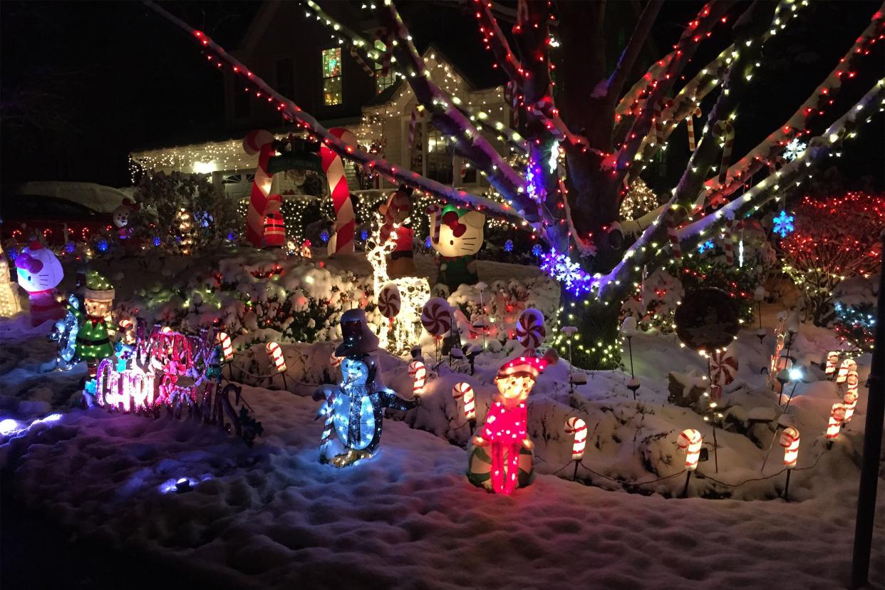 Christmas decorations and lights with fresh snow at a house on Stone Heather Drive in the Chantilly Highlands section of Oak Hill, Fairfax County, Virginia