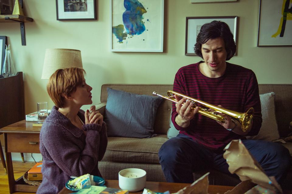 Nicole (Scarlett Johansson) gifts Charlie (Adam Driver) a trumpet in happier times in "Marriage Story."