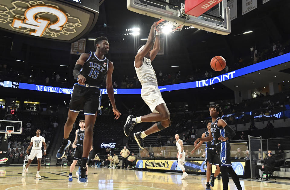 Georgia Tech's forward Moses Wright (5) hangs from the basket after dunking during the first half against Duke in an NCAA college basketball game Tuesday, March 2, 2021, in Atlanta. (Hyosub Shin/Atlanta Journal-Constitution via AP)