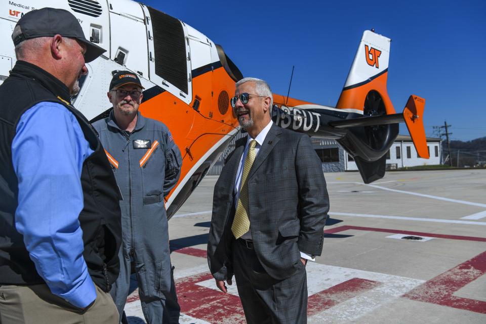 University of Tennessee Medical Center President and CEO Joe Landsman, right, talks to Jeff Gregory, left, manager of aeromedical services, and Phil Swafford, LIFESTAR pilot, on the helipad on the roof of UTMC on Feb. 15. Landsman is set to retire from the University of Tennessee Medical Center after 25 years on April 1.